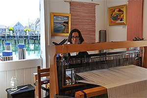 Karin Ganga Sheppard weaving in her shop on Nantucket
